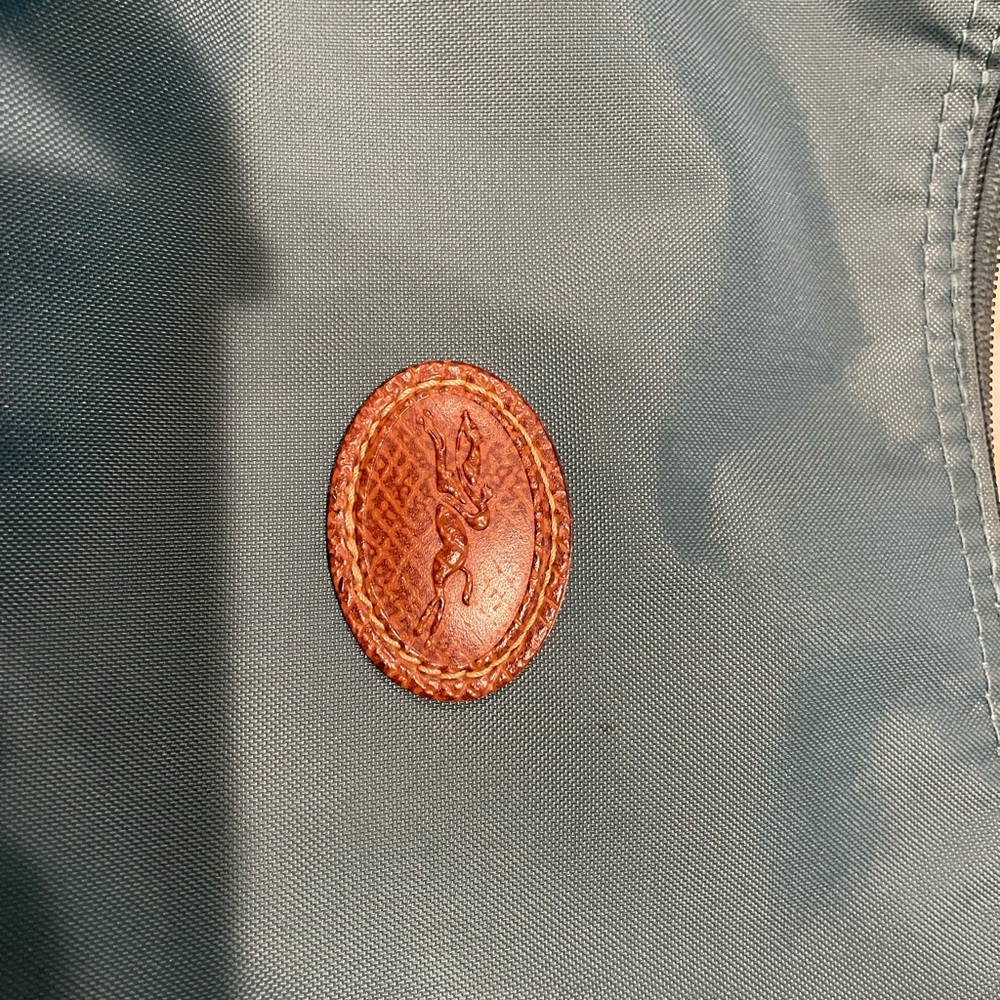 Great size Longchamp bag. No stains at all. Picture has shadows.